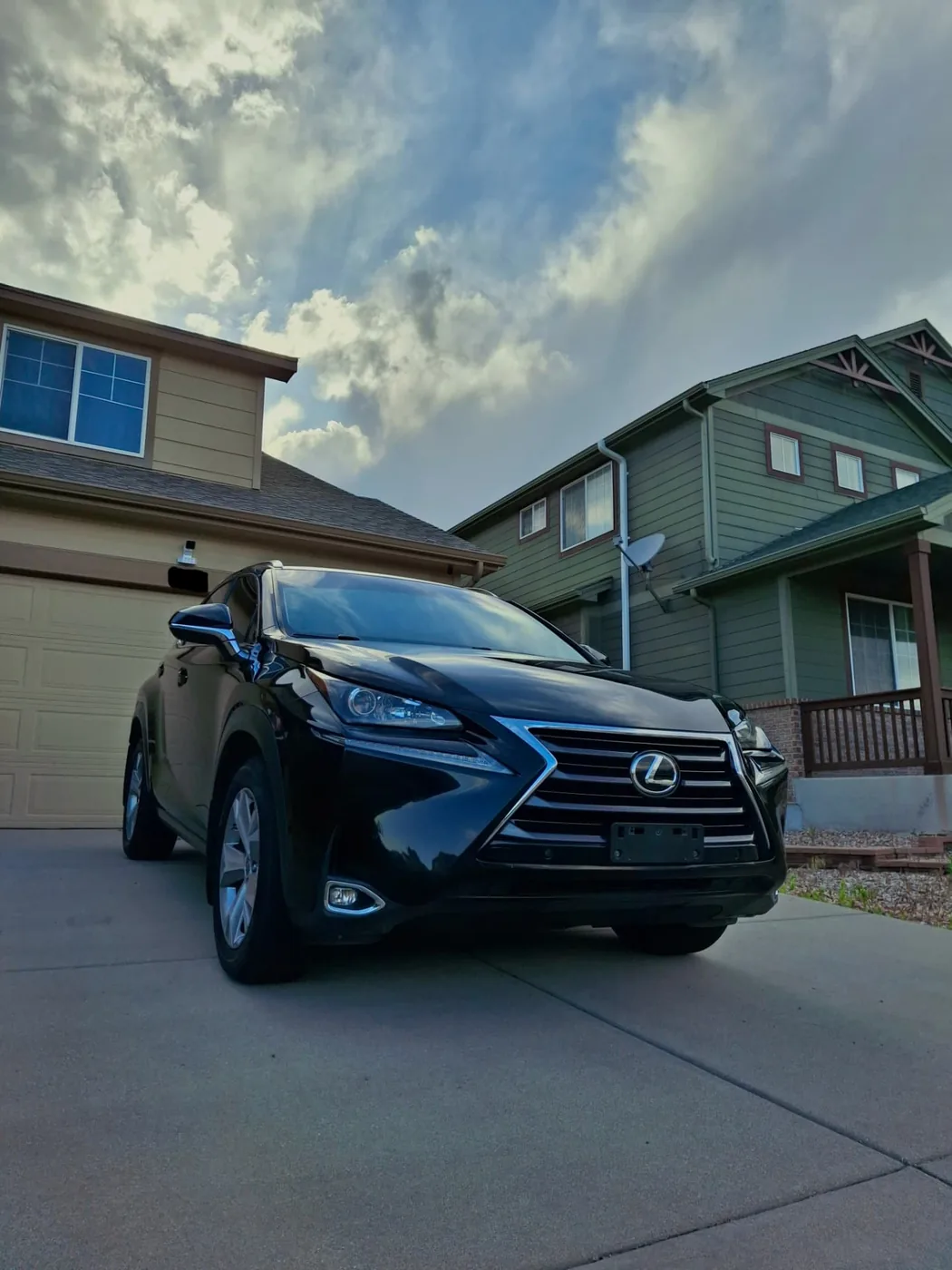 Black Lexus SUV with a freshly detailed exterior in a driveway